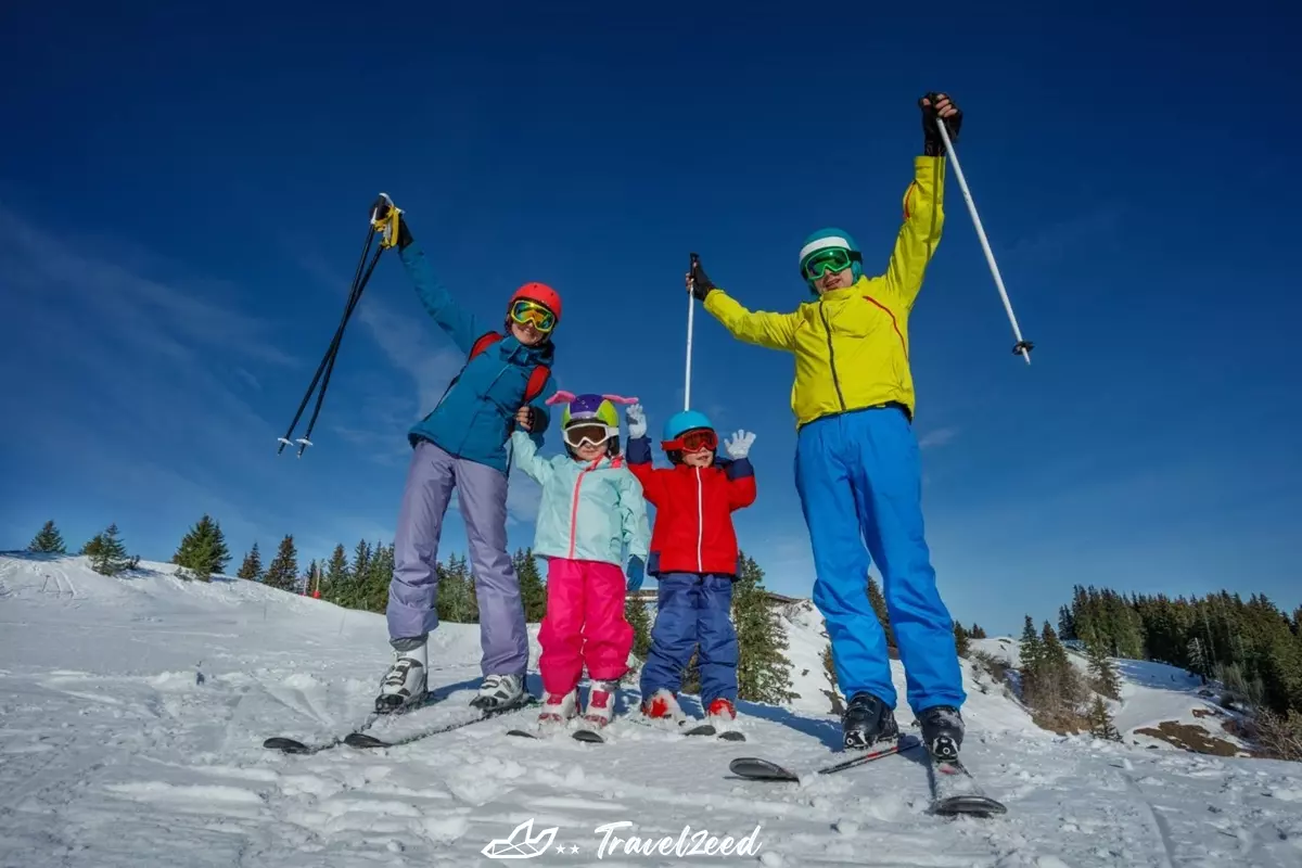 family in colorful ski outfits